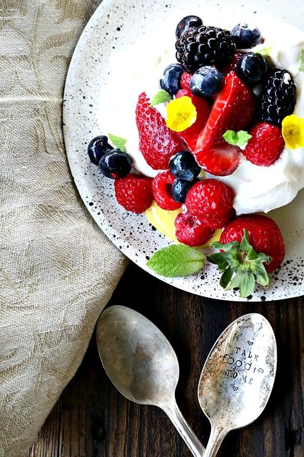Ethereally light, crisp on the outside, marshmallowy on the inside, this Mini Pavlova Recipe is foolproof and ready for summer entertaining!