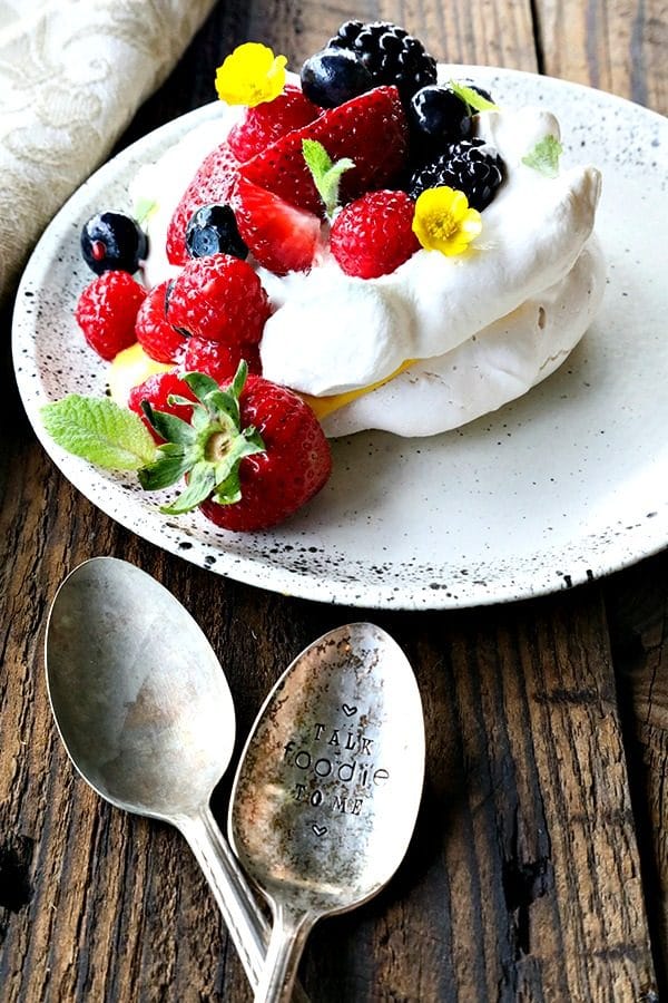 Ethereally light, crisp on the outside, marshmallowy on the inside, this Mini Pavlova Recipe is foolproof and ready for summer!