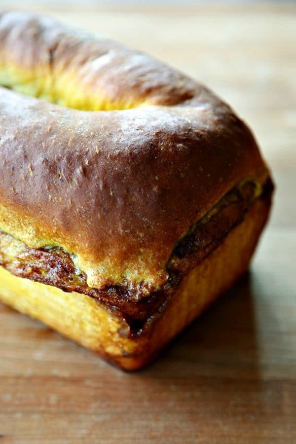 Pumpkin Cinnamon Swirl Bread is an irresistible golden-orange hued, soft, fine-crumbed bread with a decadent swirl of buttery cinnamon sugar.