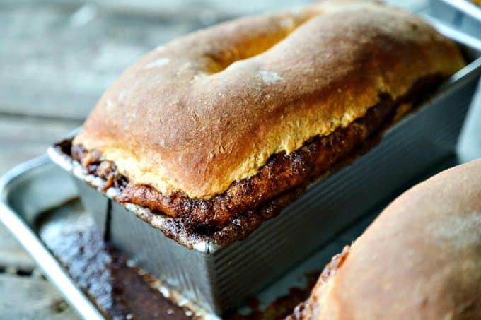 Pumpkin Cinnamon Swirl Bread is an irresistible golden-orange hued, soft, fine-crumbed bread with a decadent swirl of buttery cinnamon sugar.