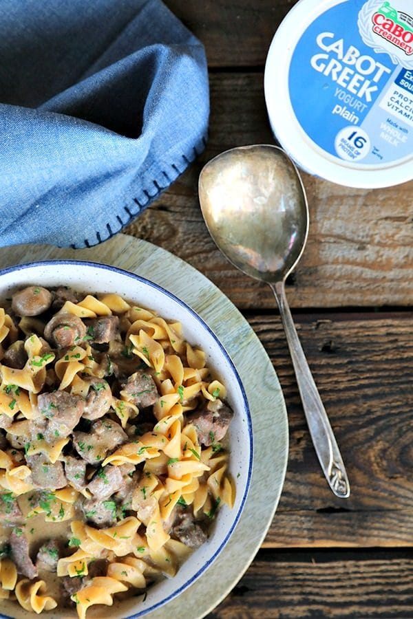 Instant Pot Garlic Beef Stroganoff: creamy, extra garlicky, mushroom and onion gravy enrobing tender beef cubes, with perfect pasta all cooked together in the Instant Pot. This has to be one of the most simple, crave-worthy comfort foods ever to be adapted to the world of electric pressure cookers.