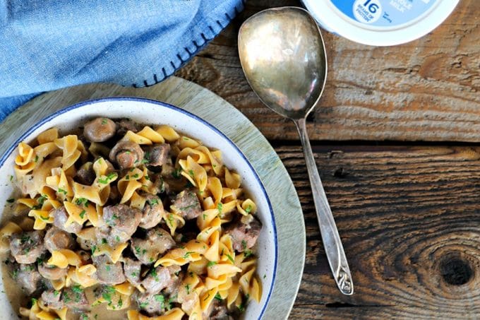 Instant Pot Garlic Beef Stroganoff: creamy, extra garlicky, mushroom and onion gravy enrobing tender beef cubes, with perfect pasta all cooked together in the Instant Pot. This has to be one of the most simple, crave-worthy comfort foods ever to be adapted to the world of electric pressure cookers.