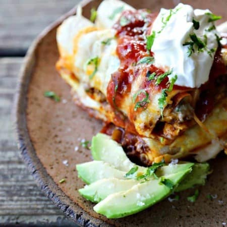 Overnight Taco Breakfast Enchiladas are the happy marriage of breakfast egg bakes, taco flavours, and enchiladas all together in one convenient, delicious package that is assembled the night before it bakes, leaving you to dream of satisfying, hearty breakfasts with no more work than sliding a pan in the oven!