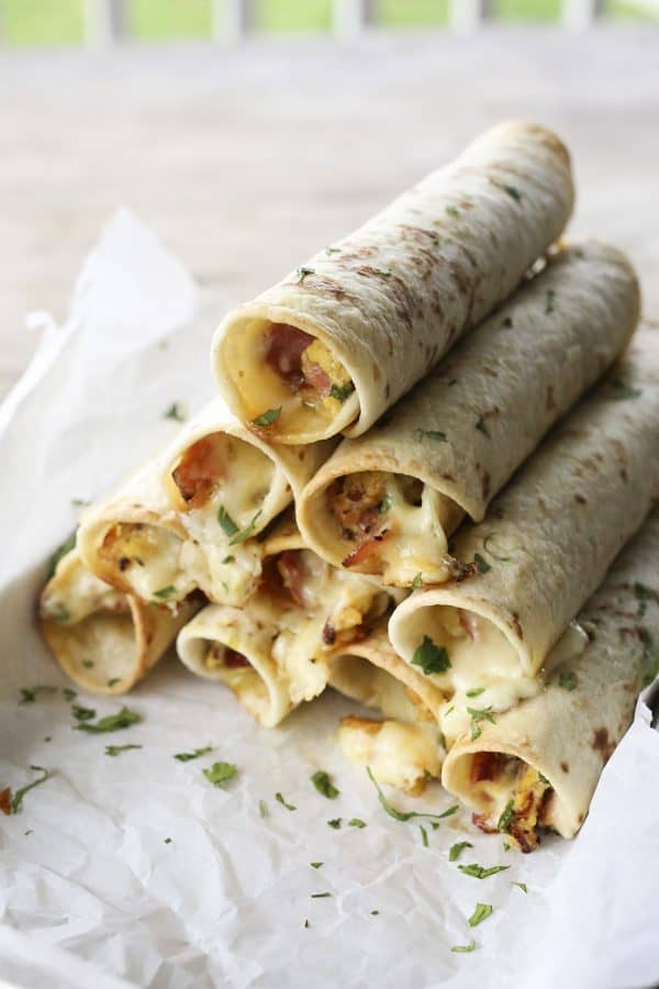 Baked Breakfast Taquitos with ham, eggs, pepperjack, and scallions.