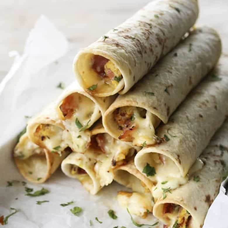 Baked Breakfast Taquitos with ham, eggs, pepperjack, and scallions.