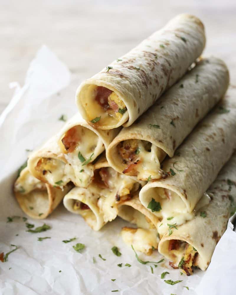 Baked Breakfast Taquitos with ham, eggs, pepperjack, and scallions.
