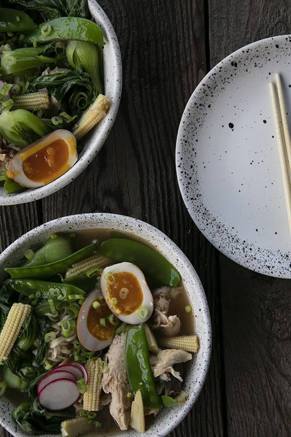 Instant Pot Chicken Ramen with jammy egg, baby corn, pea pods, bok choy, mushrooms, and radishes.