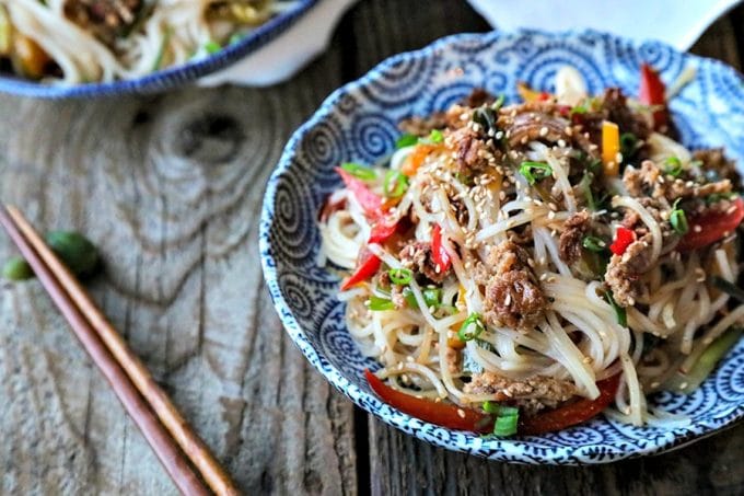 Easy Garlic Ginger Crispy Pork Noodles are going to be your new favourite dinner. Crazy simple. Crazier delicious. And easy on your pocketbook to boot. This delicious meal-in-one whips up in less than 30 minutes.