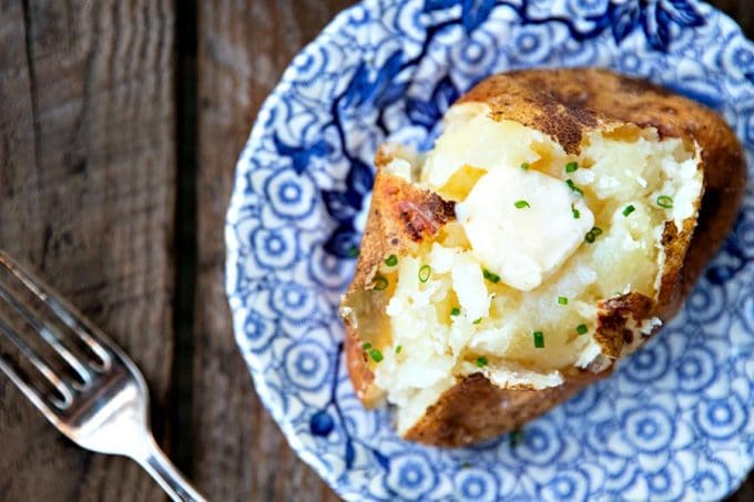 The Best Baked Potato is a thing of beauty. Our method best way to bake a potato yields a crisp, salty skin with fluffy insides every single time and is absolutely fool proof.