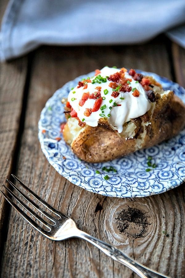 The Best Baked Potato is a thing of beauty. Our method best way to bake a potato yields a crisp, salty skin with fluffy insides every single time and is absolutely fool proof.