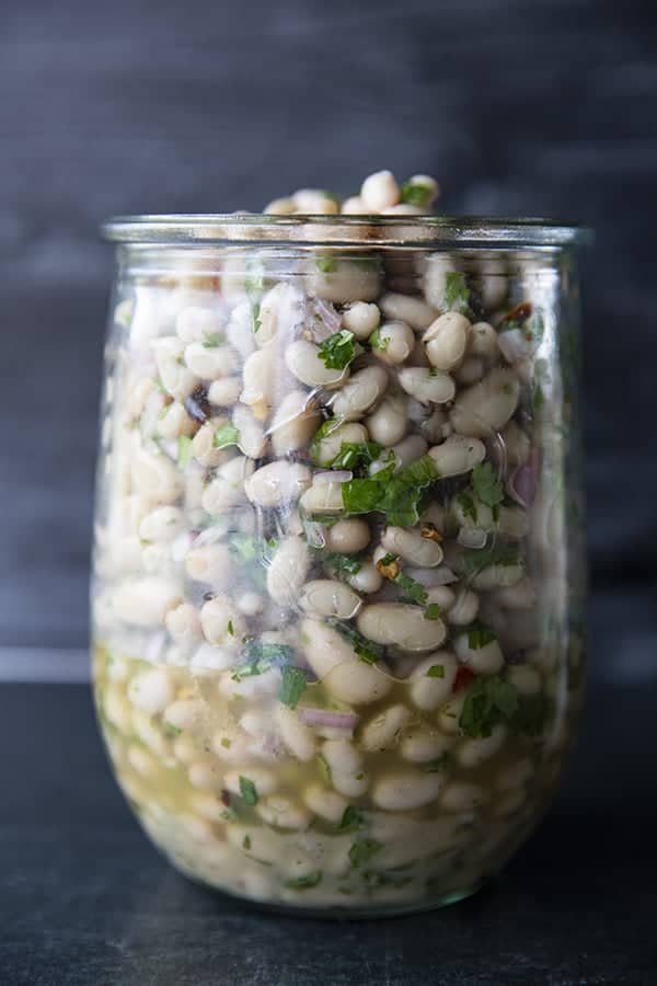 Full of fresh herb flavors, White Bean Salad comes together in a breeze. Made with canned or home cooked white beans, abundant fresh herbs, and a simple vinaigrette dressing, this salad is delicious as a light lunch on its own or as a side dish with all your favorite entrees. 