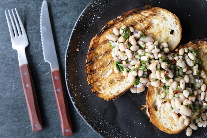 Full of fresh herb flavors, White Bean Salad comes together in a breeze. Made with canned or home cooked white beans, abundant fresh herbs, and a simple vinaigrette dressing, this salad is delicious as a light lunch on its own or as a side dish with all your favorite entrees. 