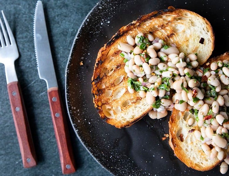 Full of fresh herb flavors, White Bean Salad comes together in a breeze. Made with canned or home cooked white beans, abundant fresh herbs, and a simple vinaigrette dressing, this salad is delicious as a light lunch on its own or as a side dish with all your favorite entrees. 