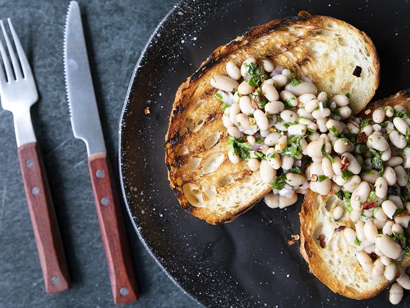 Full of fresh herb flavors, White Bean Salad comes together in a breeze. Made with canned or home cooked white beans, abundant fresh herbs, and a simple vinaigrette dressing, this salad is delicious as a light lunch on its own or as a side dish with all your favorite entrees. 