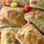 Breakfast Hot Pockets: puff pastry filled with cheesy scrambled eggs and sausage links.