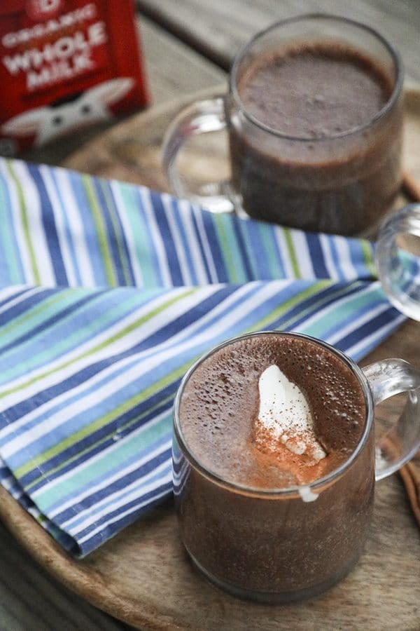Creamy, rich, blender made spiced hot chocolate is made with just two main ingredients: good chocolate and milk. It has just a hint of warming cinnamon, nutmeg, and cayenne and is as easy as the powdered packets but worlds better. 