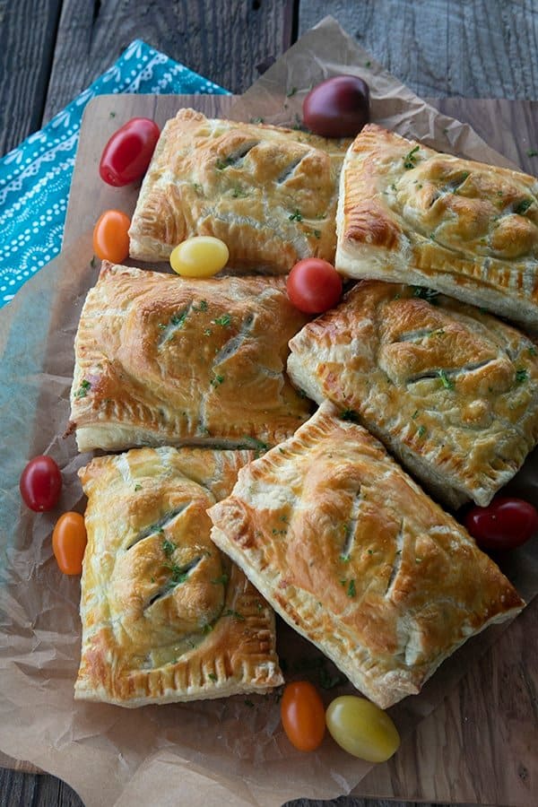 Breakfast Hot Pockets: puff pastry filled with cheesy scrambled eggs and sausage links.