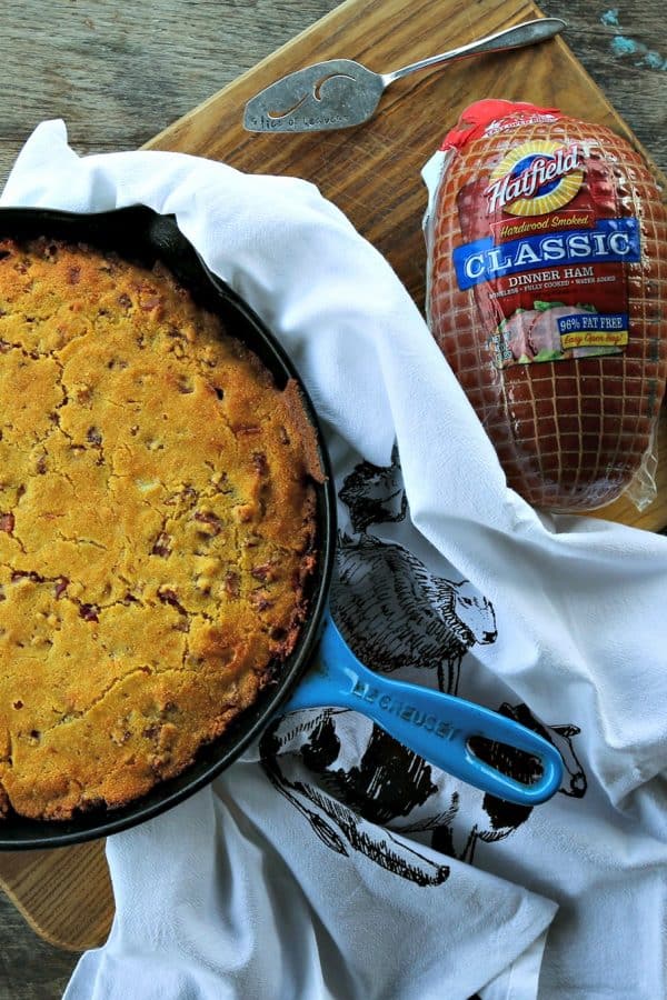 Toasty Ham Cheddar Onion Cornbread is buttermilk cornbread bursting with golden brown ham cubes, caramelized onions, and pockets of melted Cheddar cheese.