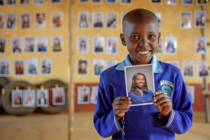 A Child looking at potential sponsors to choose through World Vision's Chosen program.