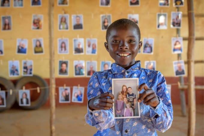 A Child looking at potential sponsors to choose through World Vision's Chosen program.